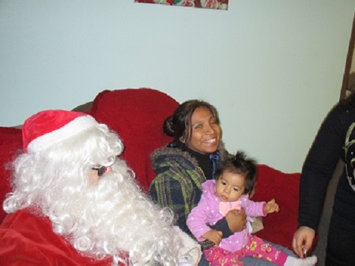 Blind Santa with a mother and child